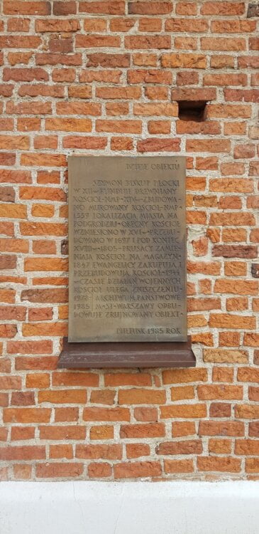 Pułtusk archiwum tablica na ścianie z czerwonej cegły